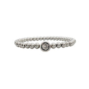 
Silver beaded bracelet featuring St. Therese medallion charm symbolizing love and faith