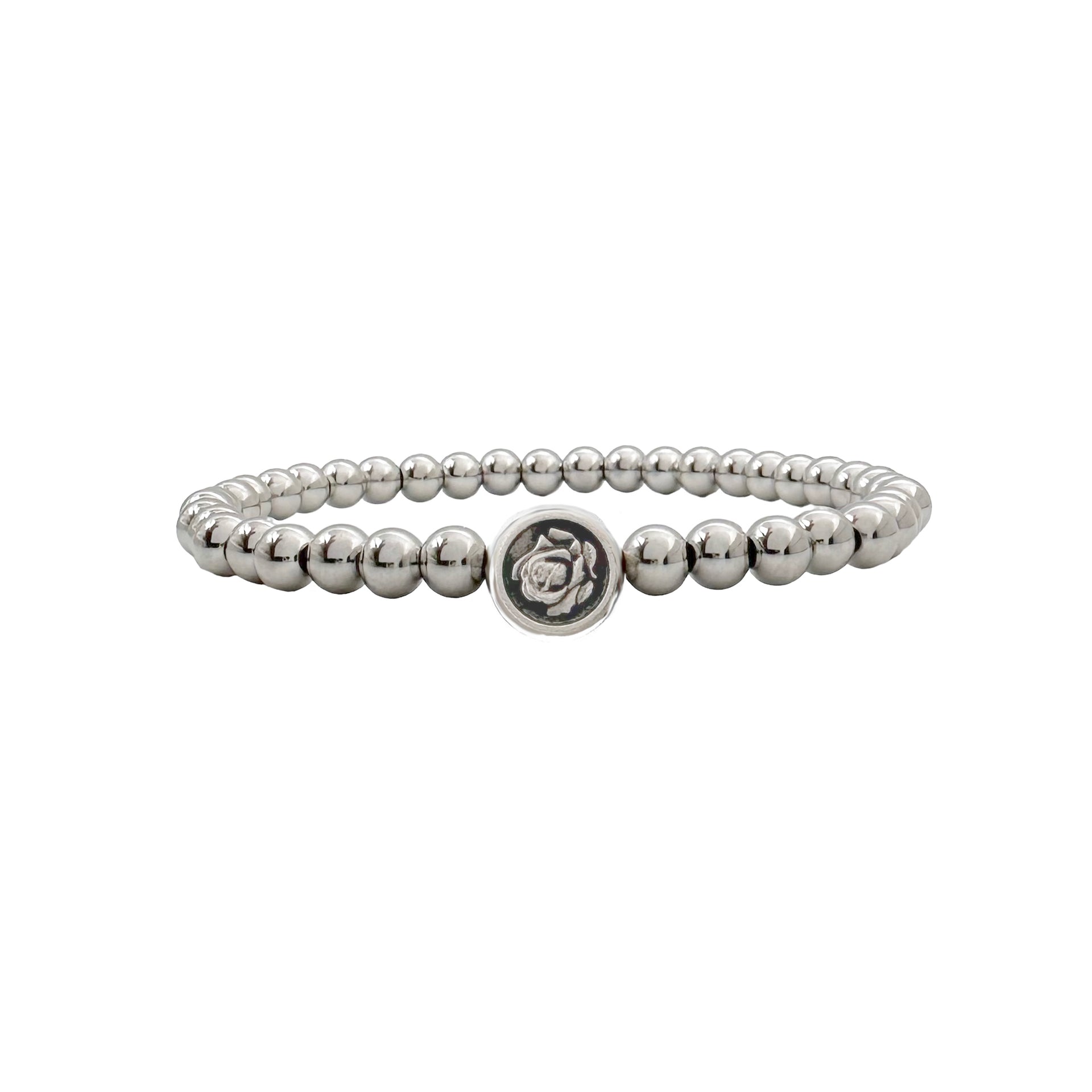 
Silver beaded bracelet featuring St. Therese medallion charm symbolizing love and faith
