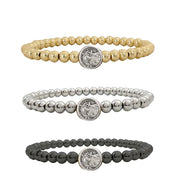 subliminal saint francis beaded bracelet in gold silver and gunmetal with double sided saint medal on stretch band