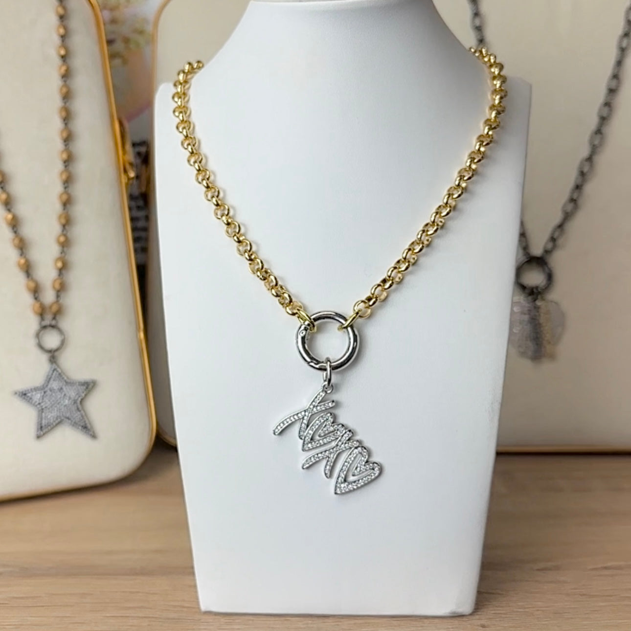 Stacie clasp necklace styled with xoxo charm front clasp statement chain