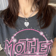 silver spiked heart necklace styled with mother t shirt