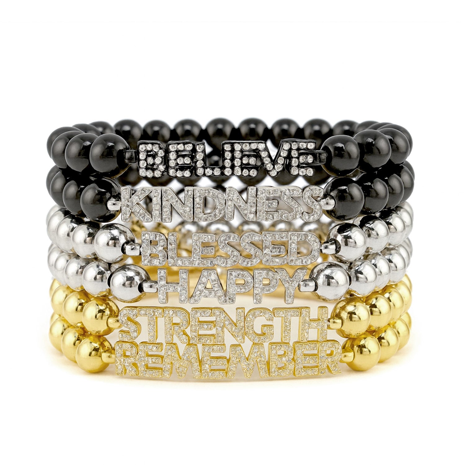 Stack of gold and silver beaded bracelets with motivational words on a white background