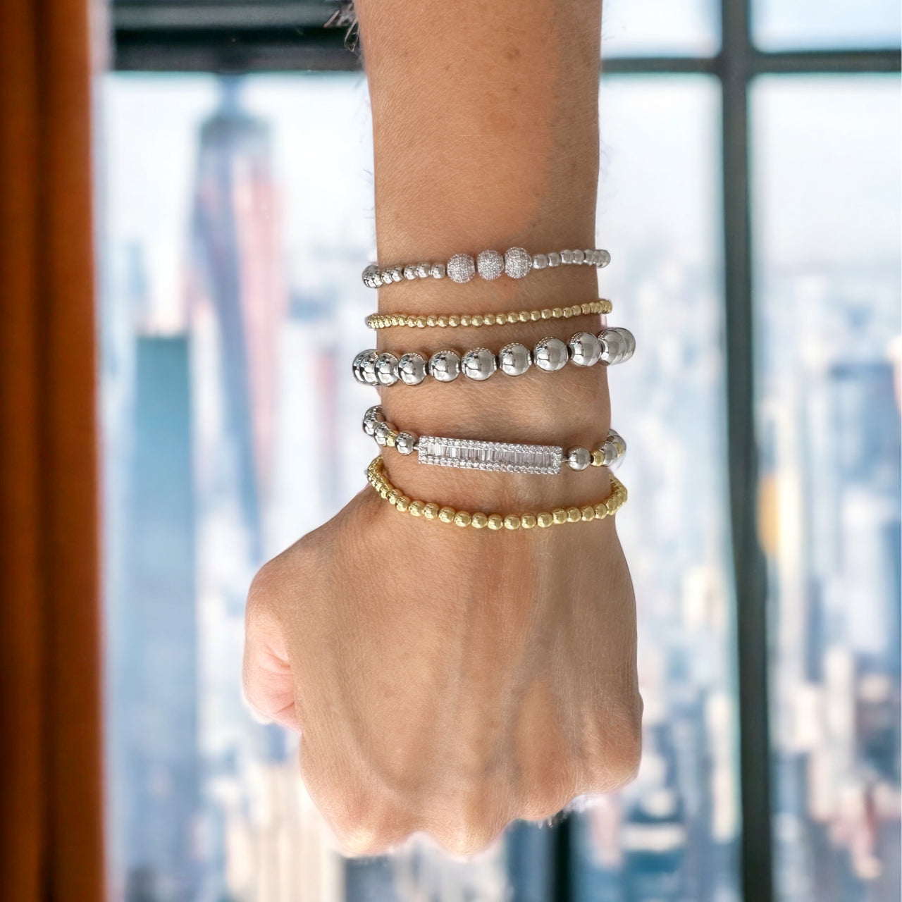 Love Lisa stacy beautiful baguette bar bracelet layered gold stretch bracelet on wrist