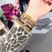 love lisa stacy initial beaded bracelet stack on wrist gold and gunmetal beaded bracelets with initial letters