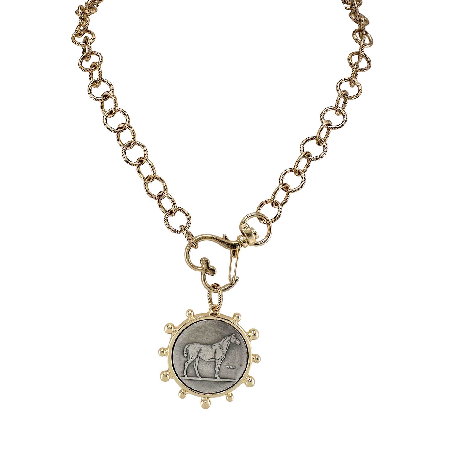 Gold necklace with a pendant featuring an engraved horse on a white background