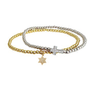 Star of David anklet layered with coordinating cross anklet in gold and silver