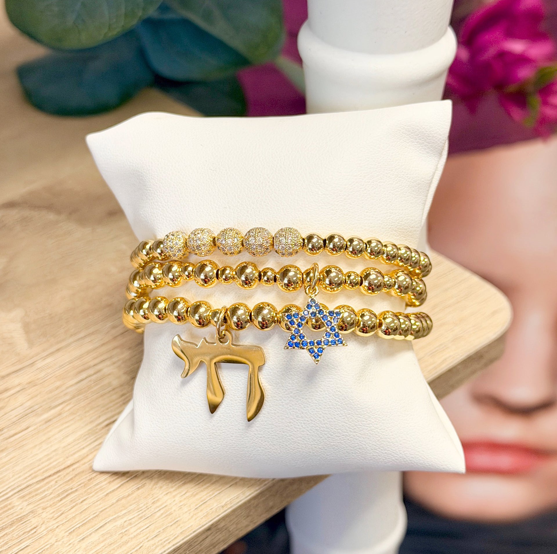 gold bracelet stack with blue star of david charm and chai charm beaded judaica jewelry
