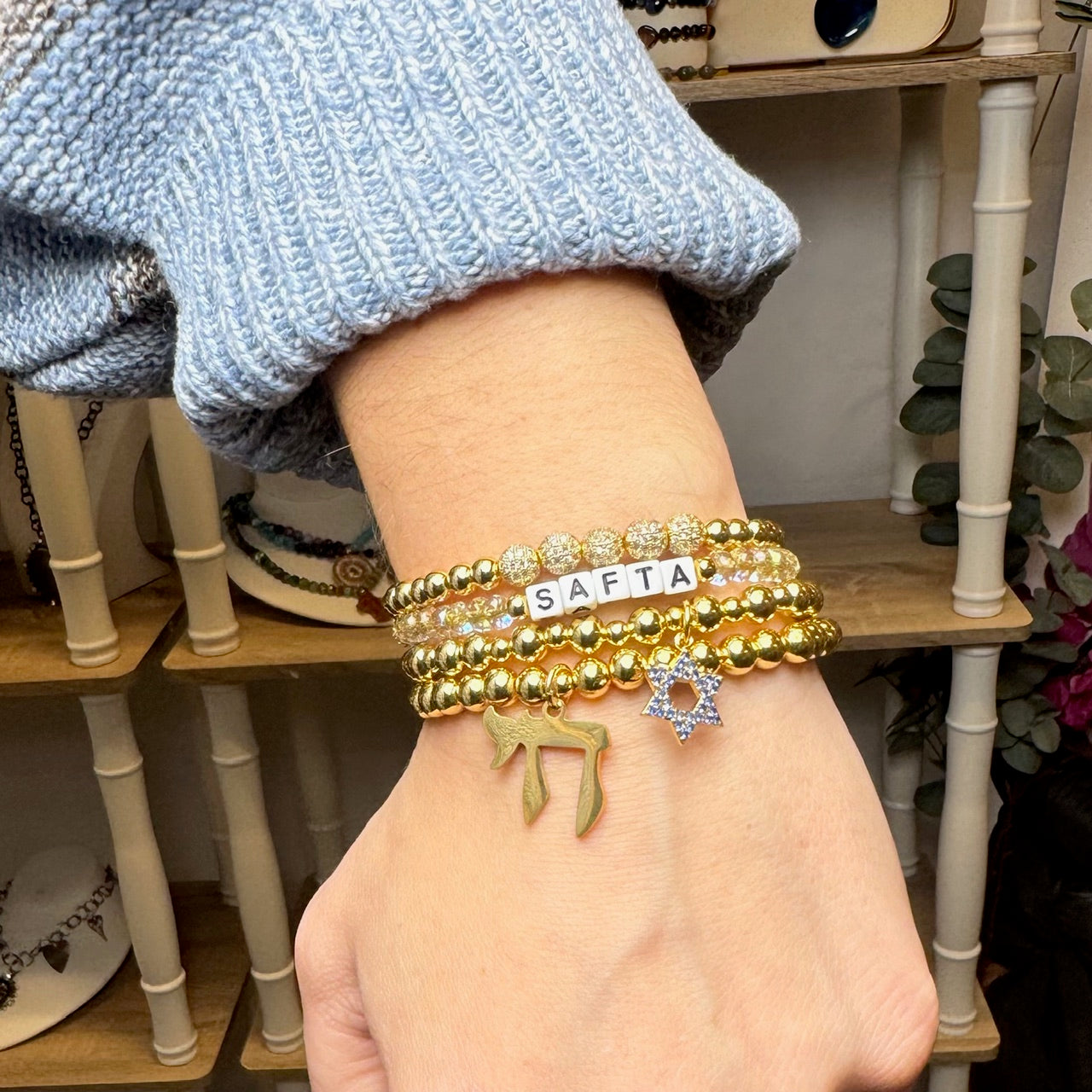 love lisa bracelet stack with star of david and chai charms layered judaica jewelry