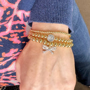 Love Lisa Subliminal Saint Francis beaded bracelet worn on wrist womens size