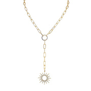 Gold necklace with a sun-shaped pendant on a white background