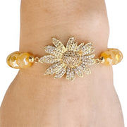 Love Lisa sunflower beaded stretch bracelet worn showing pave sunflower centerpiece and stretch bead design
