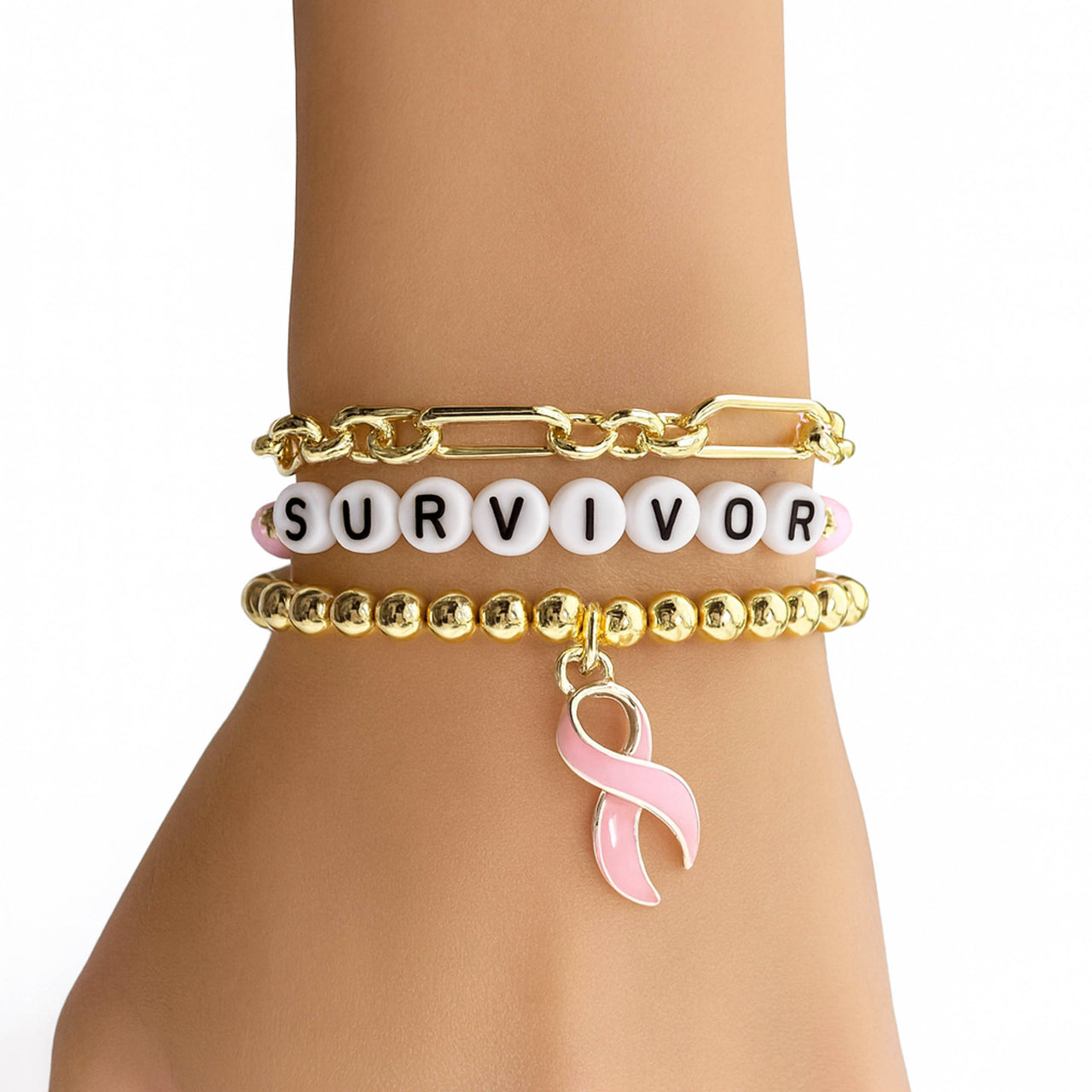 Bracelet set with 'SURVIVOR' and pink ribbon charm on a mannequin arm.