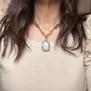 Love Lisa Tania Happy Buddha Necklace worn layered on model gold spiritual necklace