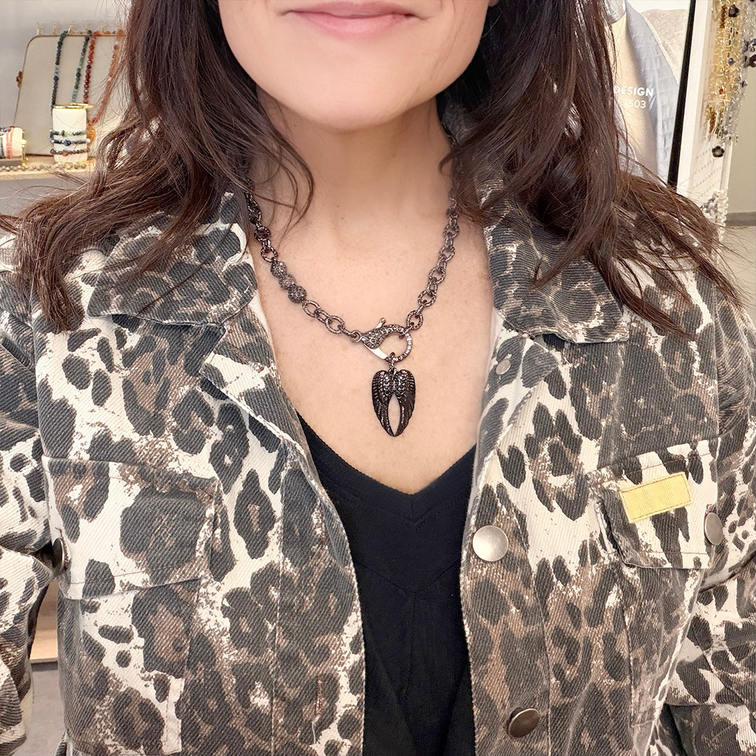 love lisa tina angel wing necklace on model layered gold chain with wing pendant