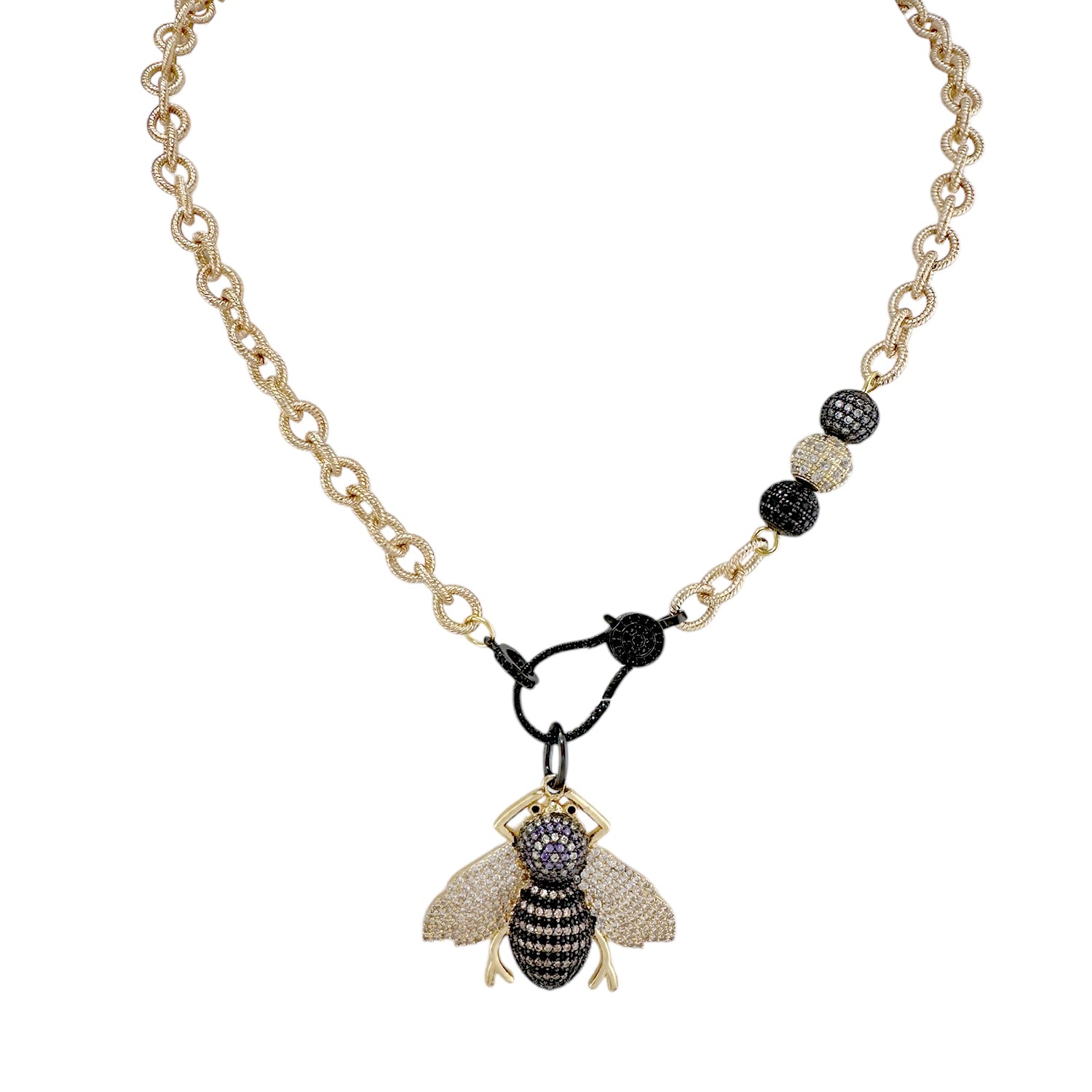 Tina’s Queen Bee Necklace in gold with black and gold crystal bee pendant

