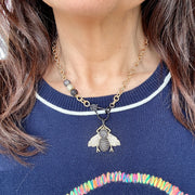 tina queen bee necklace model wearing bold bee charm
