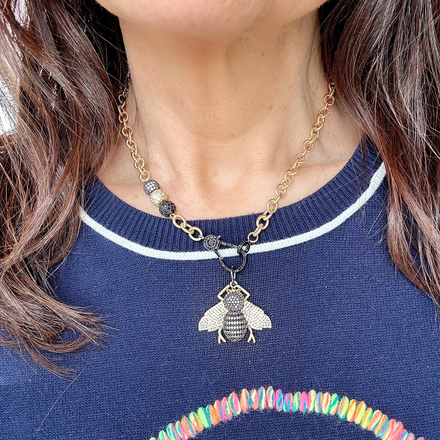 tina queen bee necklace model wearing bold bee charm
