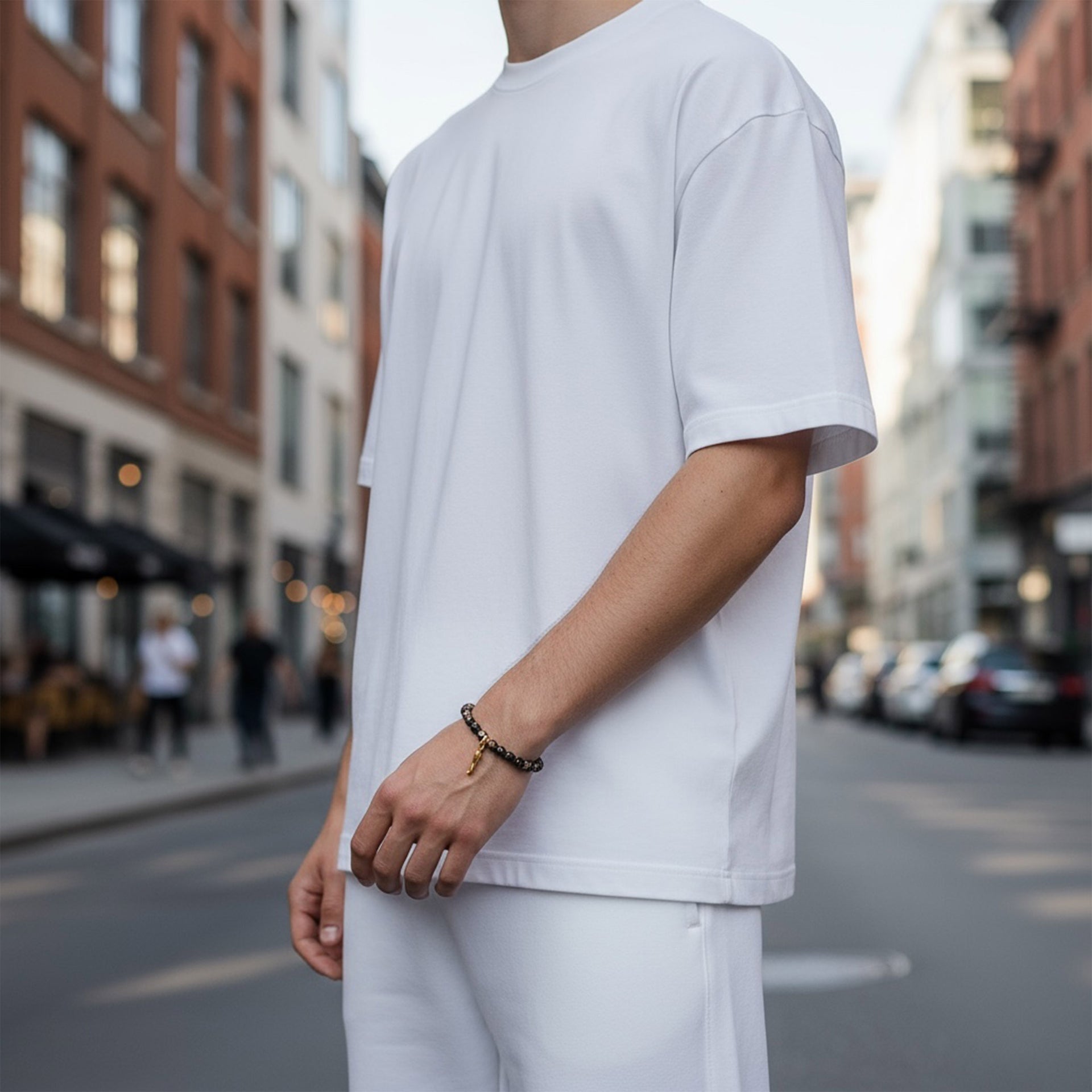 Love Lisa Tom Italian horn bracelet worn on men’s wrist showing crystal bead detail and protective cornicello charm