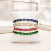 Love Lisa Trae Baguette Crystal Link Bracelets displayed in navy blue emerald green diamond and pink sapphire crystal colors