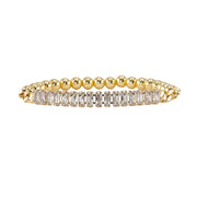 Love Lisa Trae tennis baguette bracelet featuring gold tone stretch design with clear crystal baguette stones