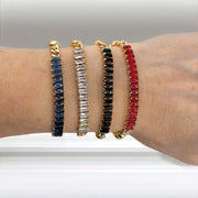 Love Lisa Trae tennis baguette bracelet styled in a layered wrist stack 