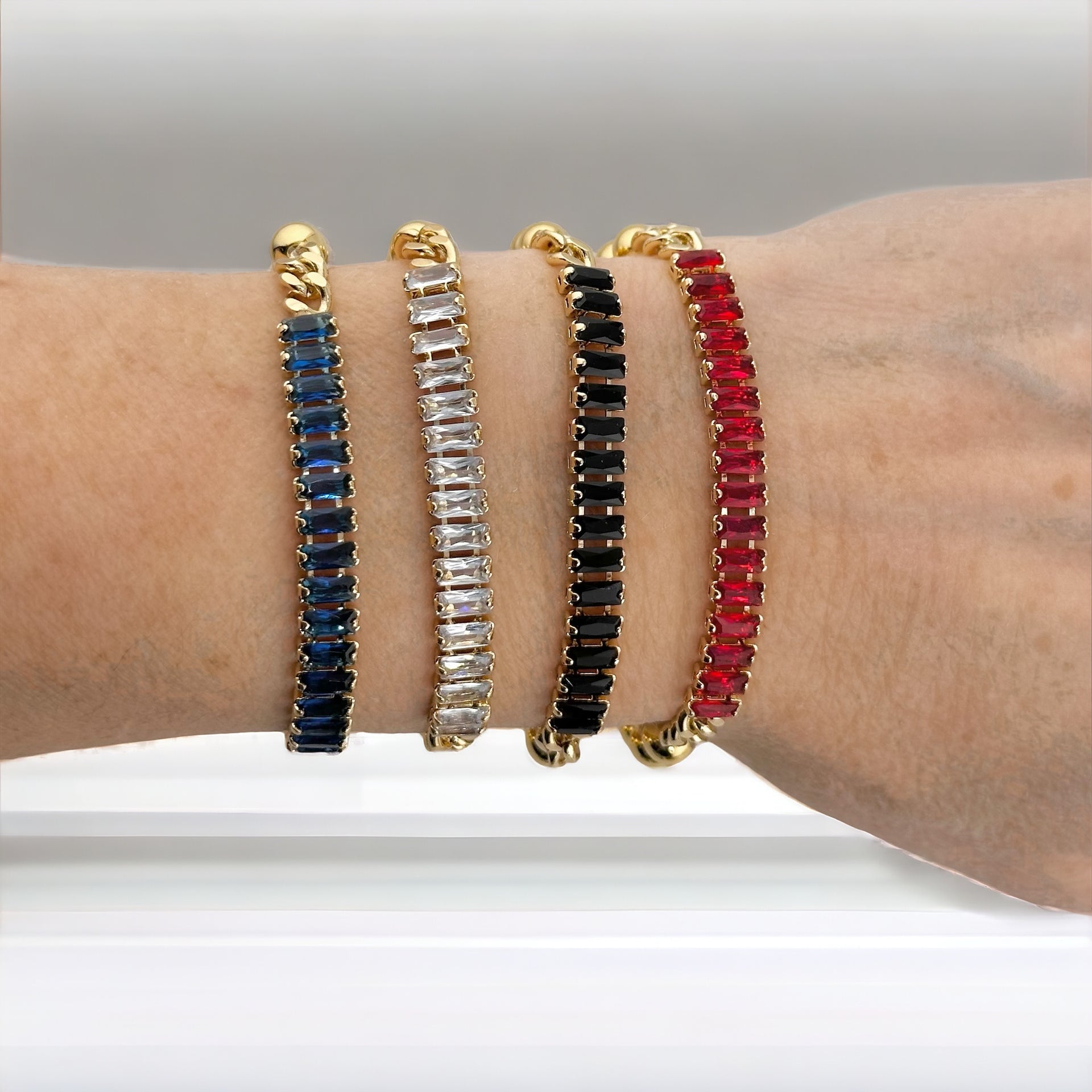 Love Lisa Trae tennis baguette bracelet styled in a layered wrist stack 