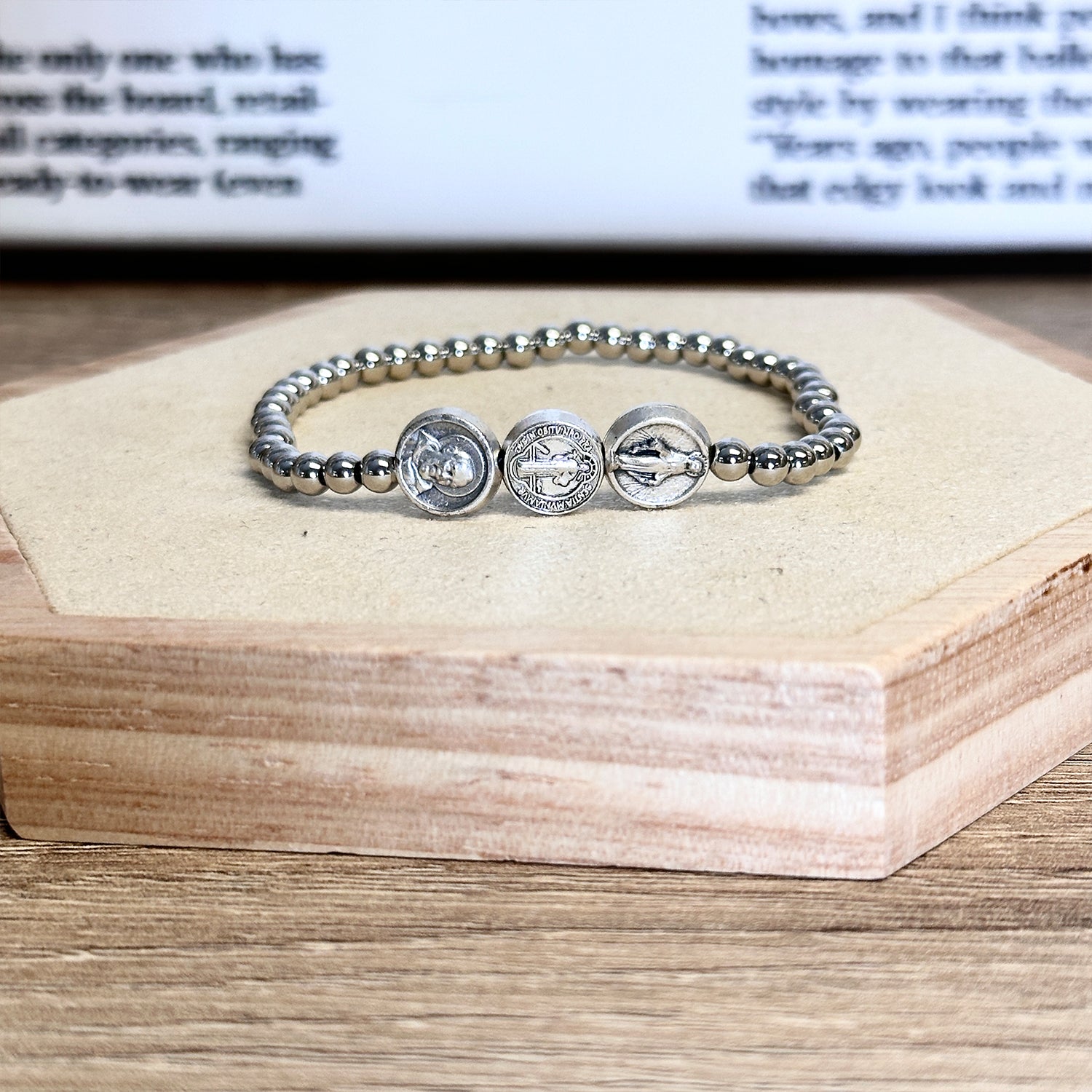 Trifecta bracelet in silver on a wood display