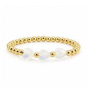 Triple Mini Heart Worry Stone Bracelet with three milky opal heart-shaped stones and polished gold-tone round beads
