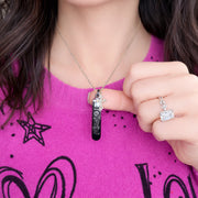 Love Lisa Trisha cross love tag necklace worn layered showing crystal LOVE tag and cross charm