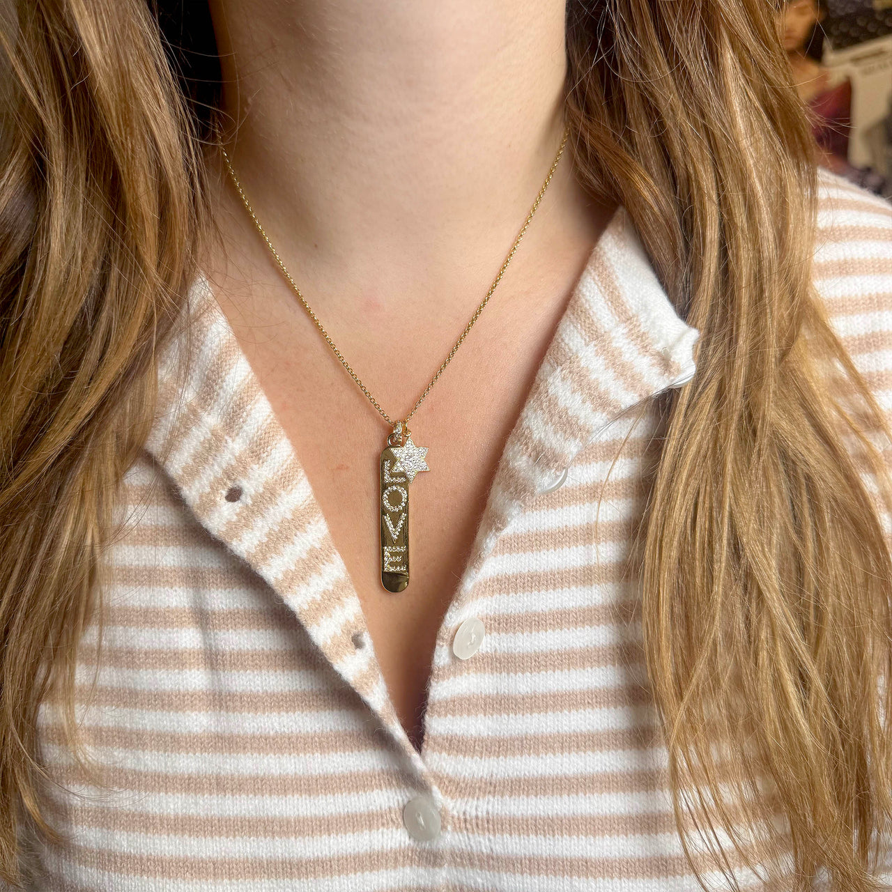 Trishias love necklace on a model