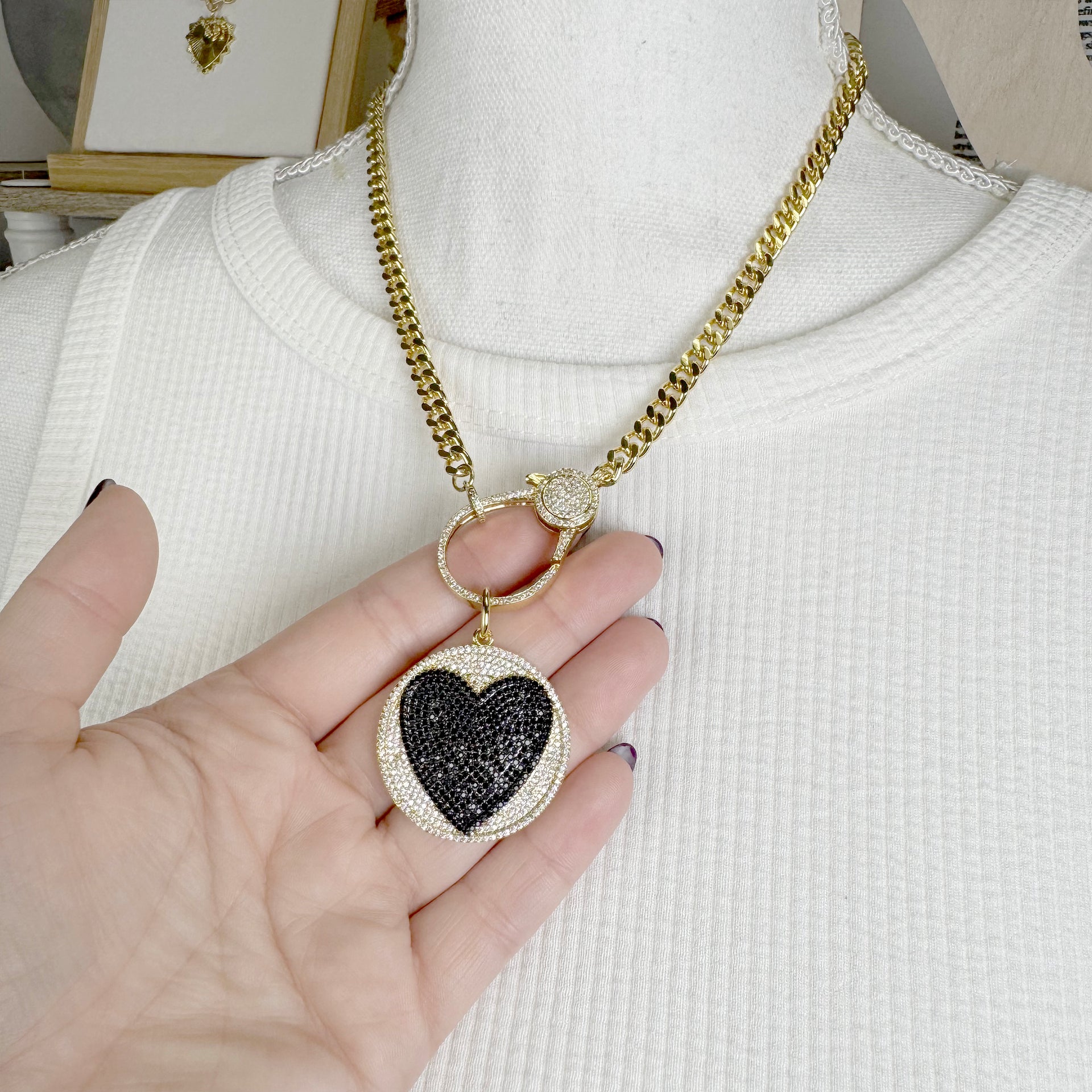 love lisa model wearing luna love heart disc charm gold black pave heart charm on clasp necklace