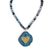 Necklace with blue agate heart pendant on a white background