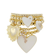 White enamel heart bracelet stack with gold tone beaded stretch bracelets romantic jewelry set