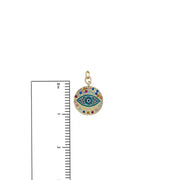 Vera evil eye charm shown beside a ruler for size reference