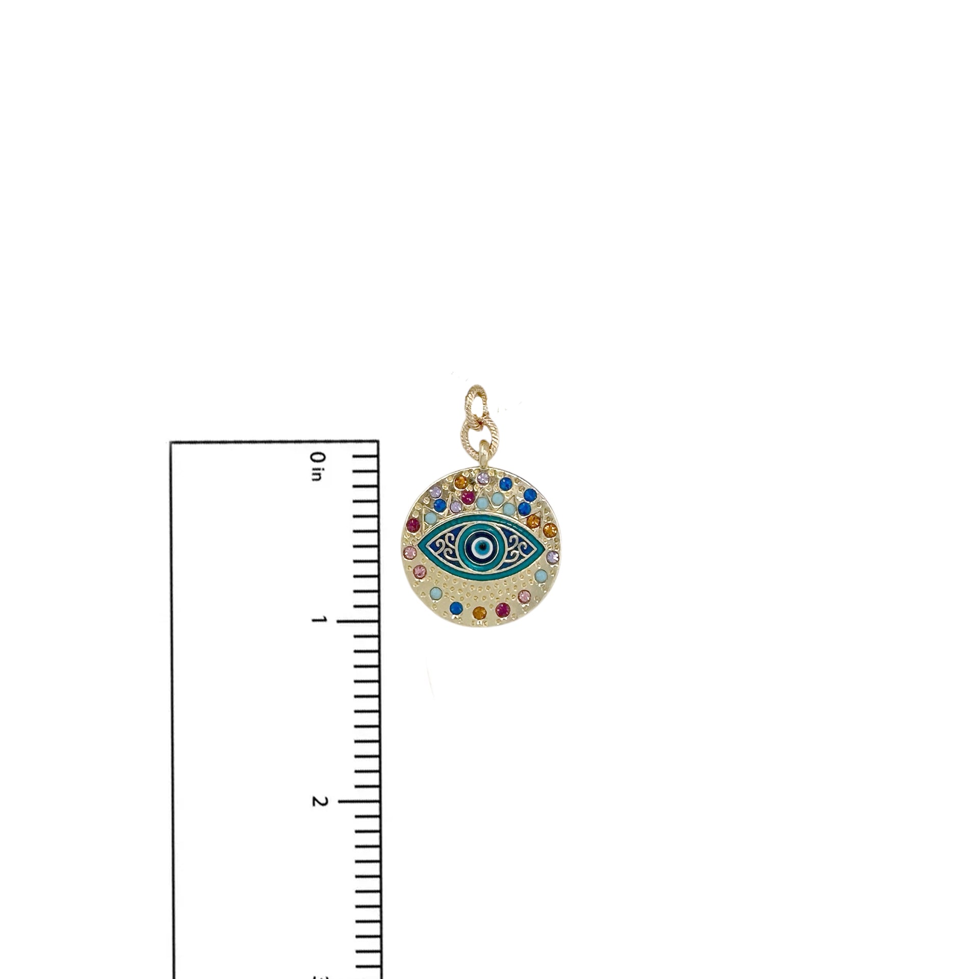 Vera evil eye charm shown beside a ruler for size reference