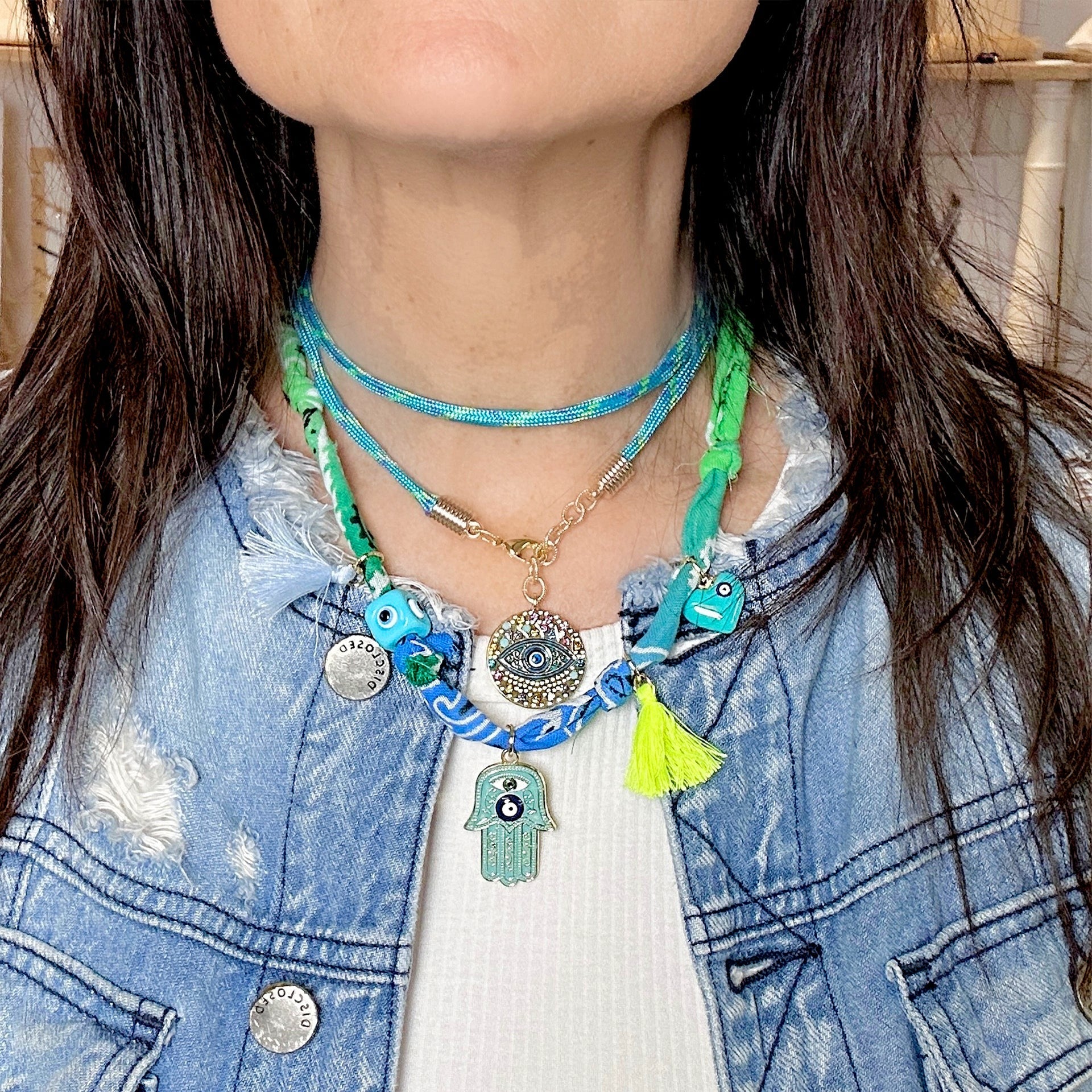 Vera evil eye royal blue coin charm on model