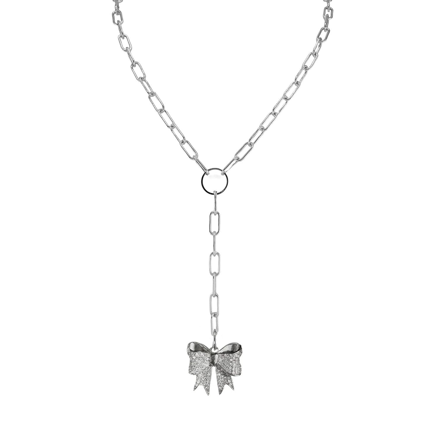 Silver necklace with a bow pendant on a white background