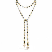 Love Lisa Vittoria Evil Eye & Howlite Quatrefoil Necklace in Black/Gold with evil eye beads, two dangling strands, sparkling accents, and cream howlite quatrefoil drops