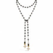 Vittoria Evil Eye & Howlite Quatrefoil Necklace in Black/Silver with evil eye beads, sparkling accents, and cream howlite quatrefoil drops