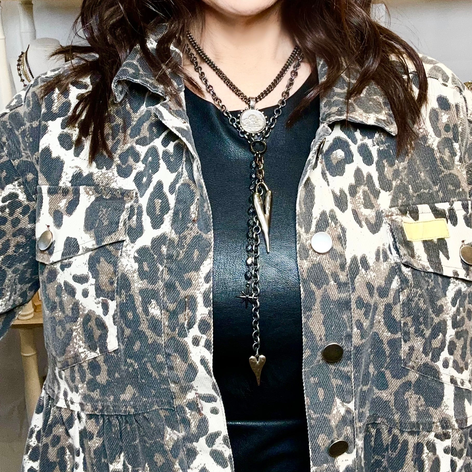 vixon drop heart necklace styled on model with leopard top