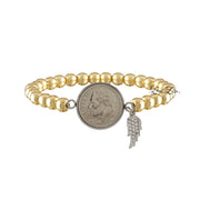 Wings Wishes Dime Bracelet with angel wing and dime charm in gold

