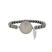 Wings & Wishes Dime Bracelet with angel wing and dime charm in gold, silver, and gunmetal

