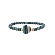 Worry Stone Harper Bracelet in Mystic Lagoon with faceted crystal beads, gold-tone accents, and heart-shaped worry stone focal bead