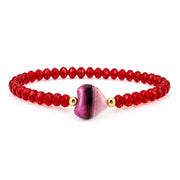 Worry Stone Harper Bracelet in Red with faceted crystal beads, gold-tone accents, and heart-shaped worry stone focal bead