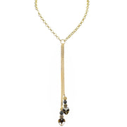 Love Lisa Worry Stone Heart Double Drop Necklace with gold-tone chain, center ring, two cascading drops, sparkling black bead accents, and smooth black heart worry stones