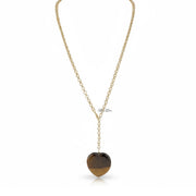 Gold necklace with a heart-shaped brown worry stone pendant on a white background