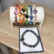 Love Lisa Worry Stone Sea Sediment Jasper Bracelets shown with calming message card and multiple color optio