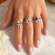 Love Lisa Zahav Star of David Stretch Ring worn on hand in gold with pavé Star of David charm