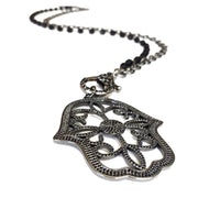 Black openwork hamsa charm with clear stones