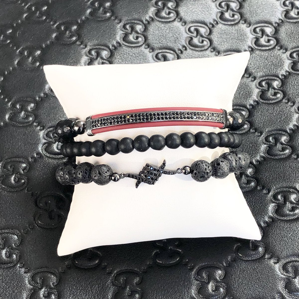 andrews leather beaded tranquility bracelet displayed on jewelry pillow with black diamond accents love lisa mens bracelet